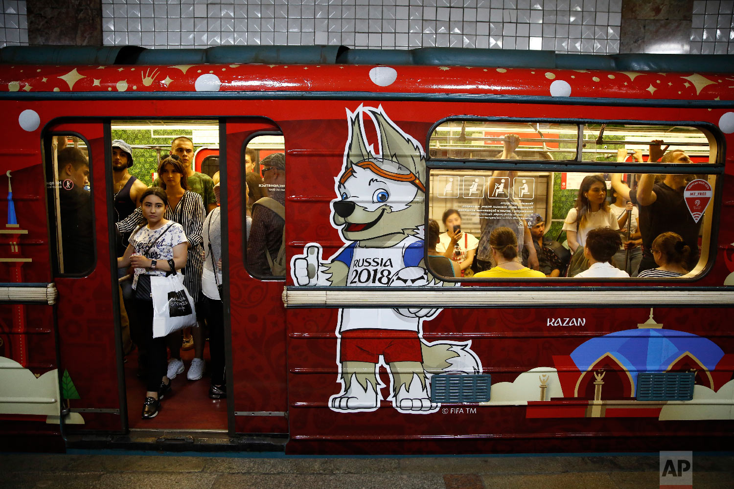  Commuters ride home on a subway car decorated for the 2018 soccer World Cup, in Moscow, Russia on June 30, 2018. (AP Photo/Rebecca Blackwell) 