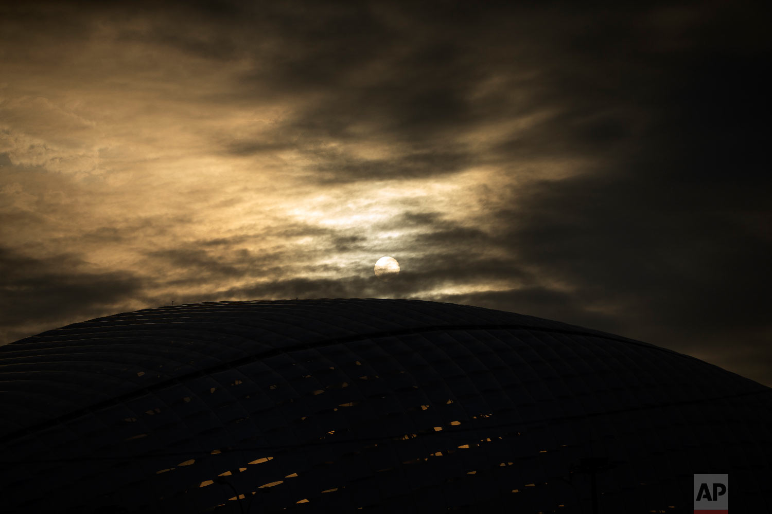  The sun shines through the clouds above the Fisht Stadium at the 2018 soccer World Cup in Sochi, Russia on June 29, 2018. (AP Photo/Francisco Seco) 