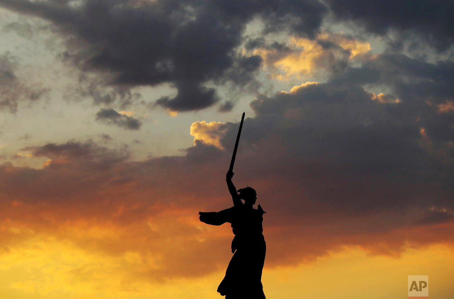  The sun sets over "The Motherland Calls" memorial during near the Volgograd Arena during the 2018 soccer World Cup in Volgograd, Russia on June 27, 2018. (AP Photo/Eugene Hoshiko) 