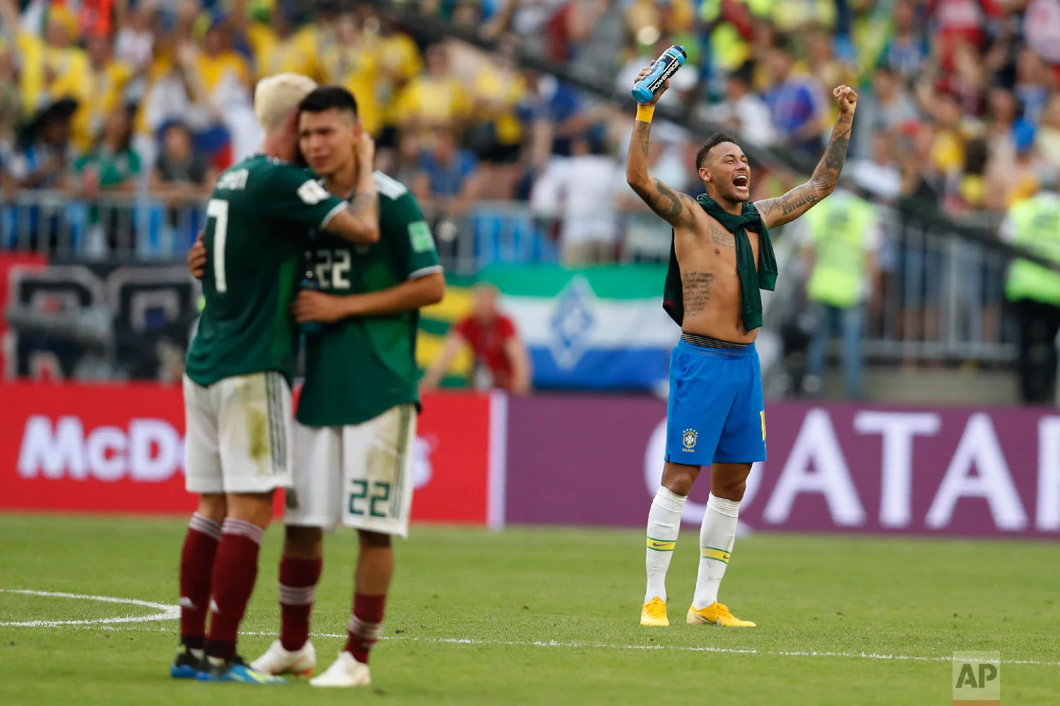 Brazil's Neymar celebrates as Mexico's Miguel Layun and teammates Hirving Lozano embrace at the end of their round of 16 match at the 2018 soccer World Cup in the Samara Arena, in Samara, Russia, Monday, July 2, 2018. Brazil won 2-0. (AP Photo/Eduardo Verdugo)