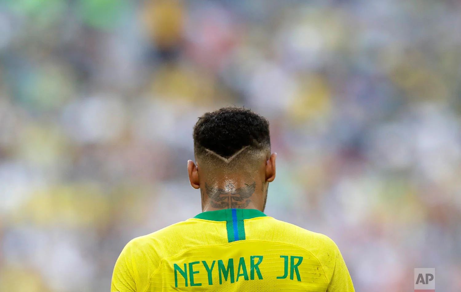 Brazil's Neymar walks on the pitch during the round of 16 match between Brazil and Mexico at the 2018 soccer World Cup in the Samara Arena, in Samara, Russia, Monday, July 2, 2018. (AP Photo/Andre Penner)