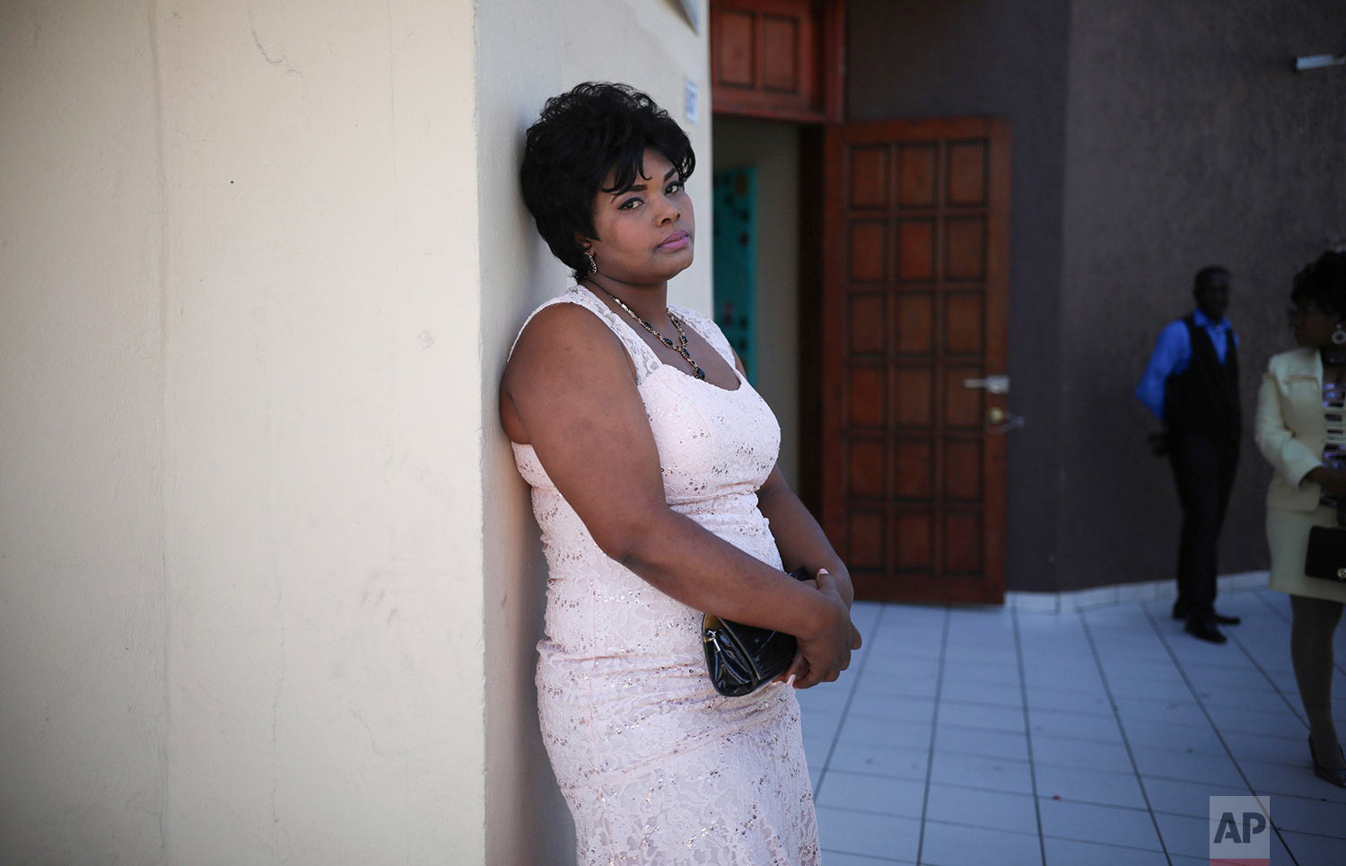  In this May 5, 2018 photo published in June, a Haitian migrant bride waits for the start of a group wedding at the First Baptist Church of Tijuana, Mexico. (AP Photo/Emilio Espejel) 