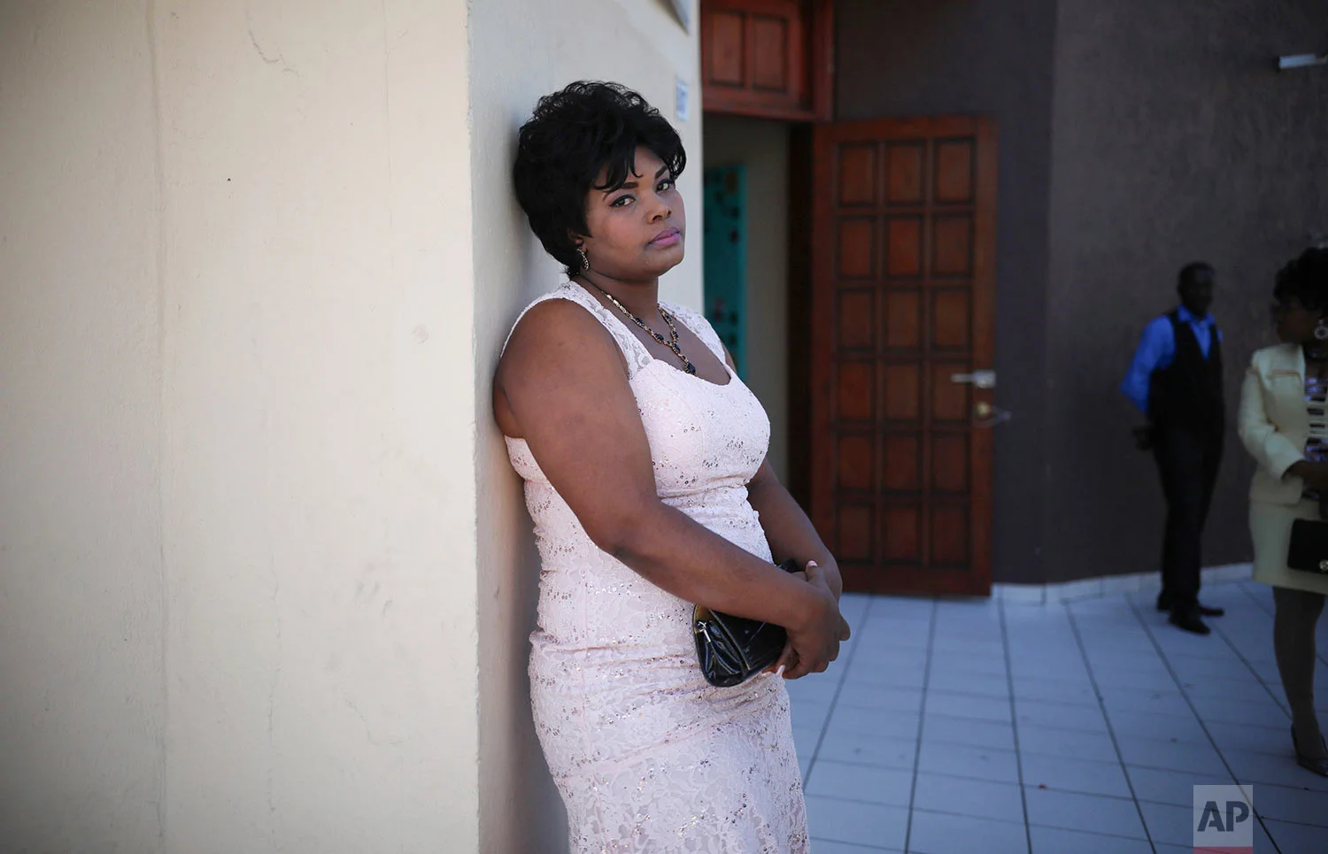 In this May 5, 2018 photo published in June, a Haitian migrant bride waits for the start of a group wedding at the First Baptist Church of Tijuana, Mexico. (AP Photo/Emilio Espejel)