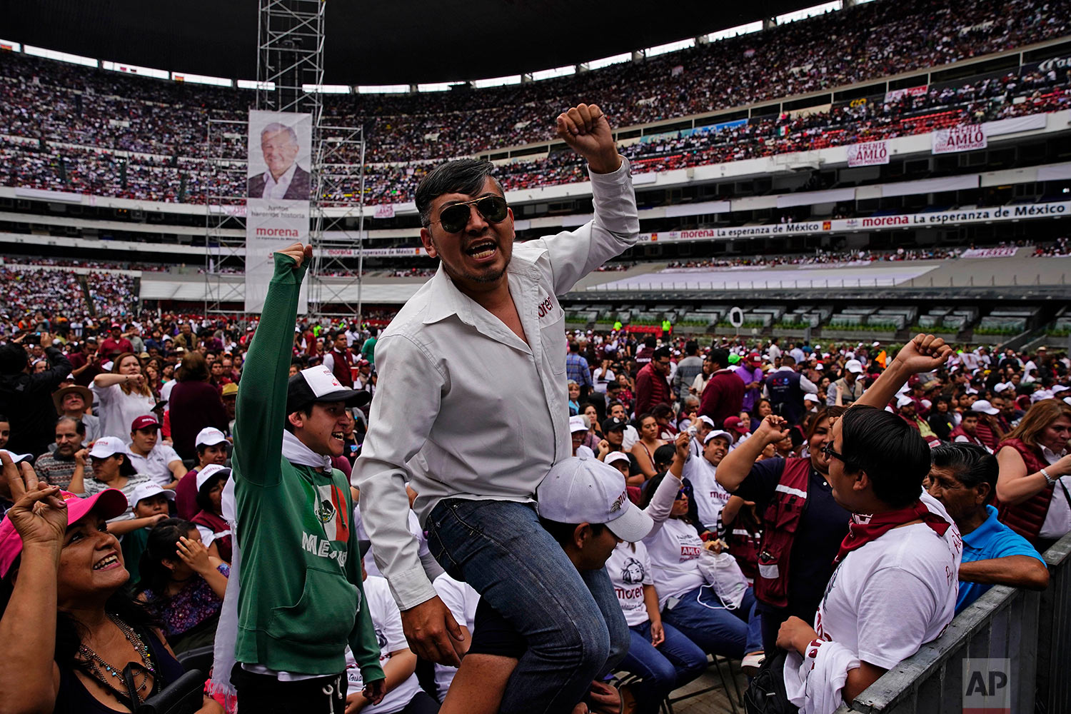  Supporters of presidential candidate Andres Manuel Lopez Obrador wait for their candidate's arrival during his closing campaign rally at Azteca stadium in Mexico City, June 27, 2018. (AP Photo/Ramon Espinosa) 