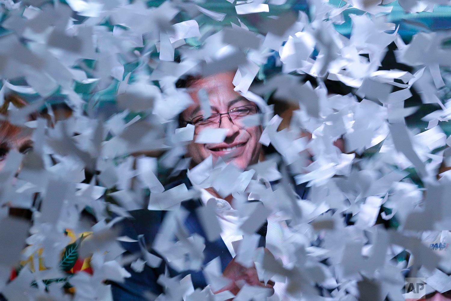  Presidential candidate Gustavo Petro is surrounded in ticker tape as he speaks to supporters after his rival Ivan Duque won the election in Bogota, Colombia, June 17, 2018. (AP Photo/Martin Mejia) 