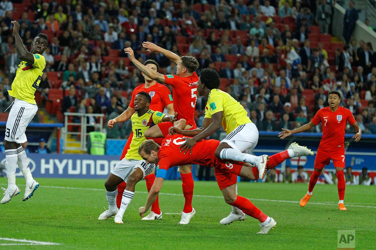  Colombia's Carlos Sanchez, front right, fouls England's Harry Kane to give a penalty during the round of 16 match between Colombia and England at the 2018 soccer World Cup in the Spartak Stadium, in Moscow, Russia, Tuesday, July 3, 2018. (AP Photo/V