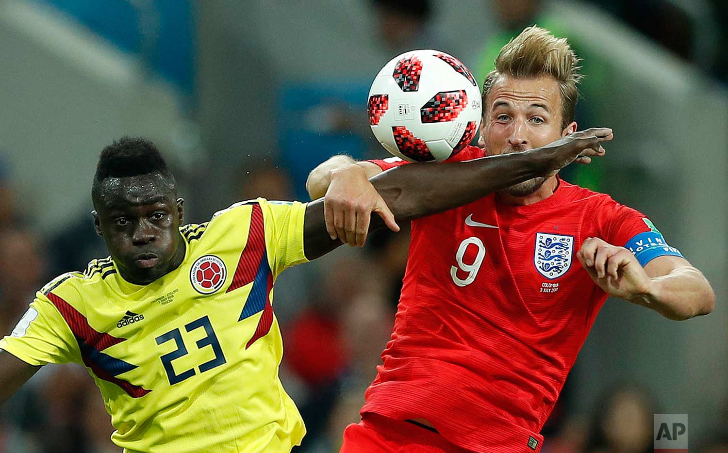  Colombia's Davinson Sanchez, left, and England's Harry Kane challenge for the ball during the round of 16 match between Colombia and England at the 2018 soccer World Cup in the Spartak Stadium, in Moscow, Russia, Tuesday, July 3, 2018. (AP Photo/Ala