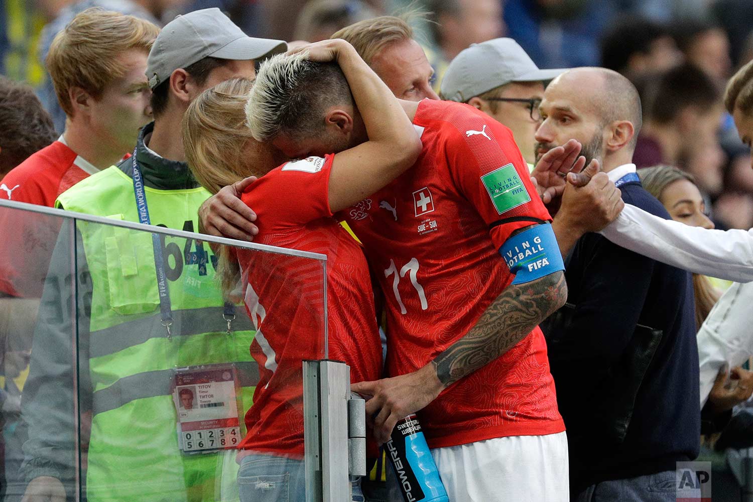  Switzerland's Valon Behrami hugs a woman after the round of 16 match between Switzerland and Sweden at the 2018 soccer World Cup in the St. Petersburg Stadium, in St. Petersburg, Russia, Tuesday, July 3, 2018. Sweden won 1-0. (AP Photo/Gregorio Borg