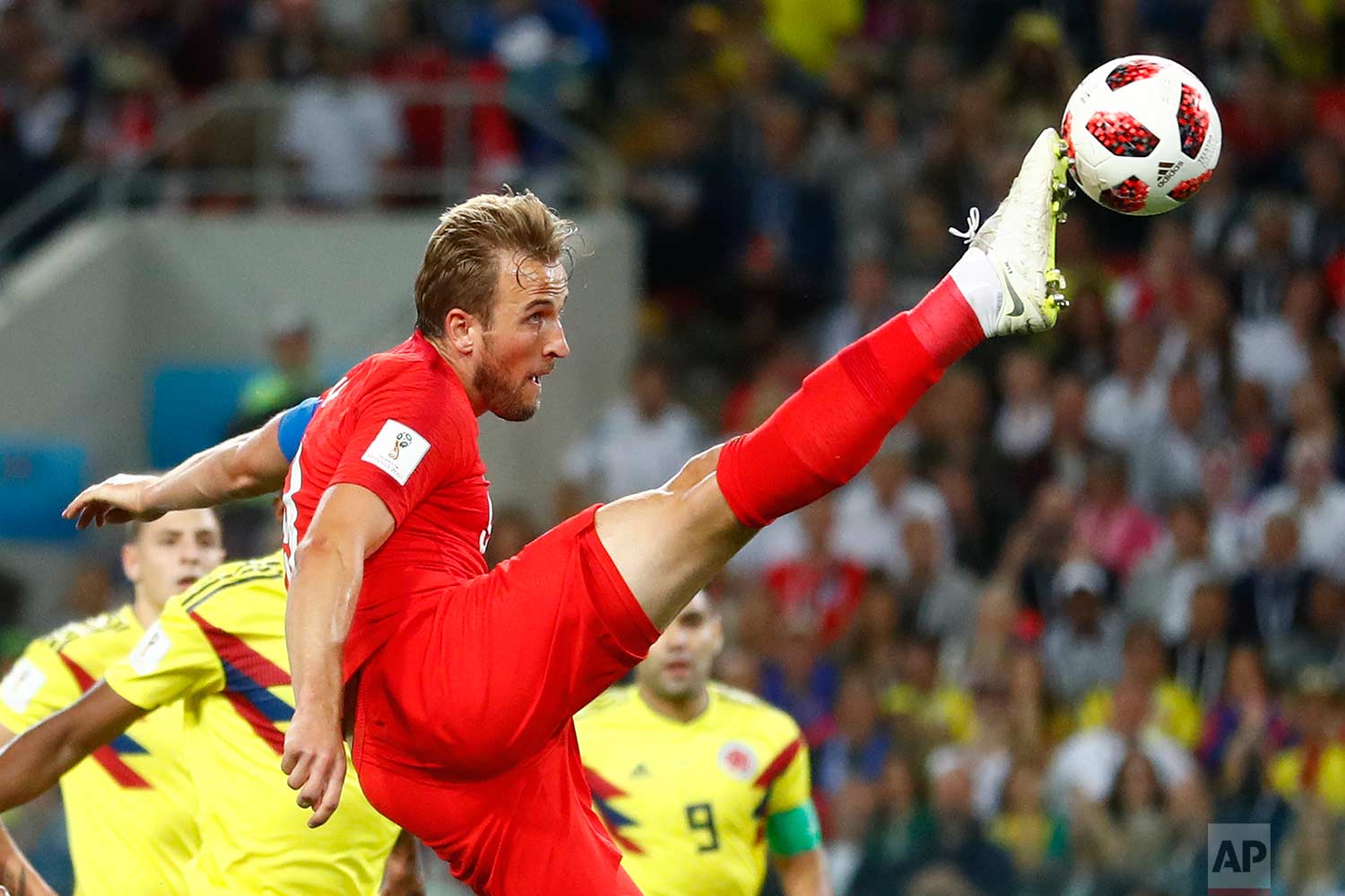 England's Harry Kane tries to control the ball during the round of 16 match between Colombia and England at the 2018 soccer World Cup in the Spartak Stadium, in Moscow, Russia, Tuesday, July 3, 2018. (AP Photo/Matthias Schrader)