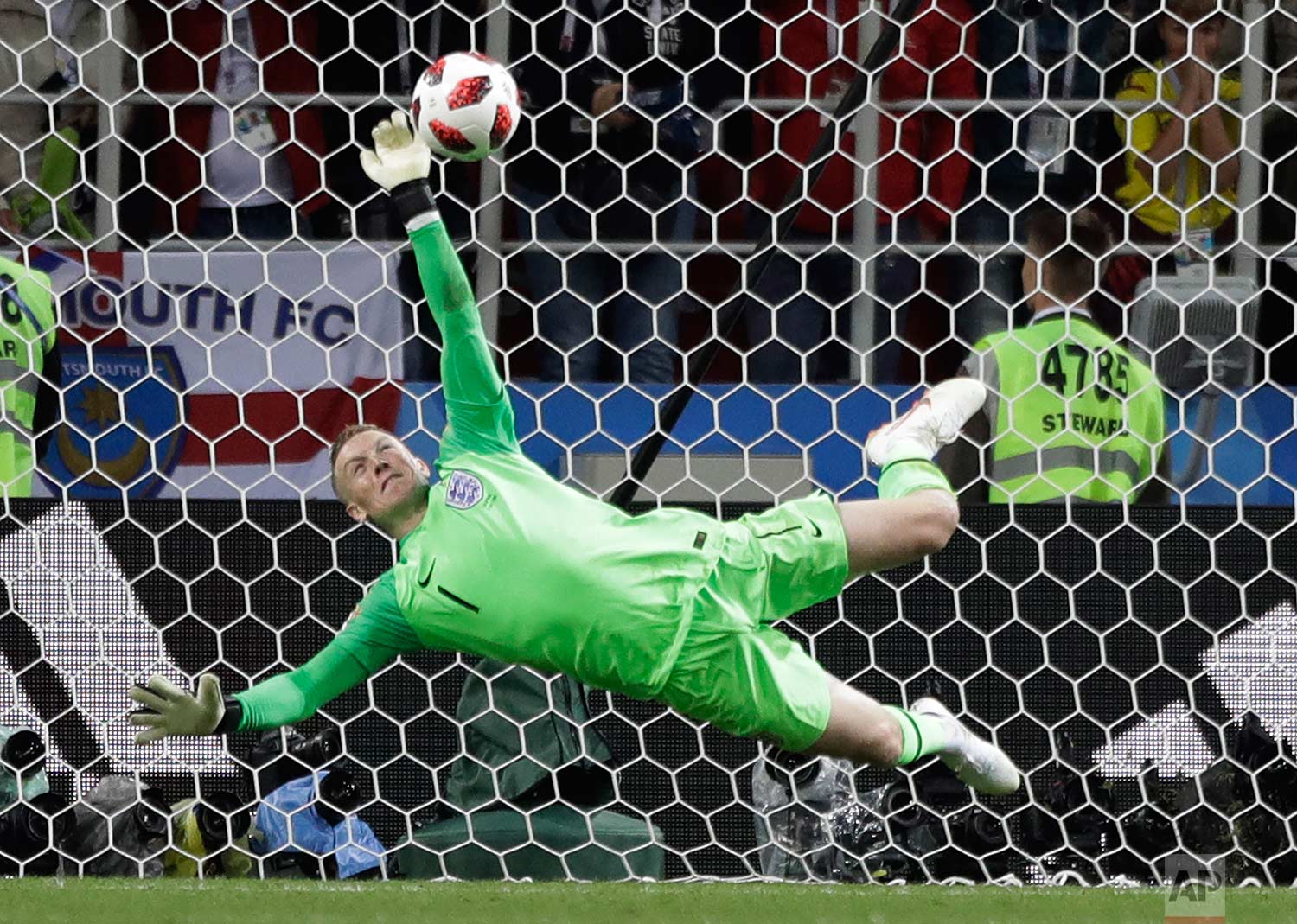  England goalkeeper Jordan Pickford saves a penalty during the round of 16 match between Colombia and England at the 2018 soccer World Cup in the Spartak Stadium, in Moscow, Russia, Tuesday, July 3, 2018. (AP Photo/Matthias Schrader) 