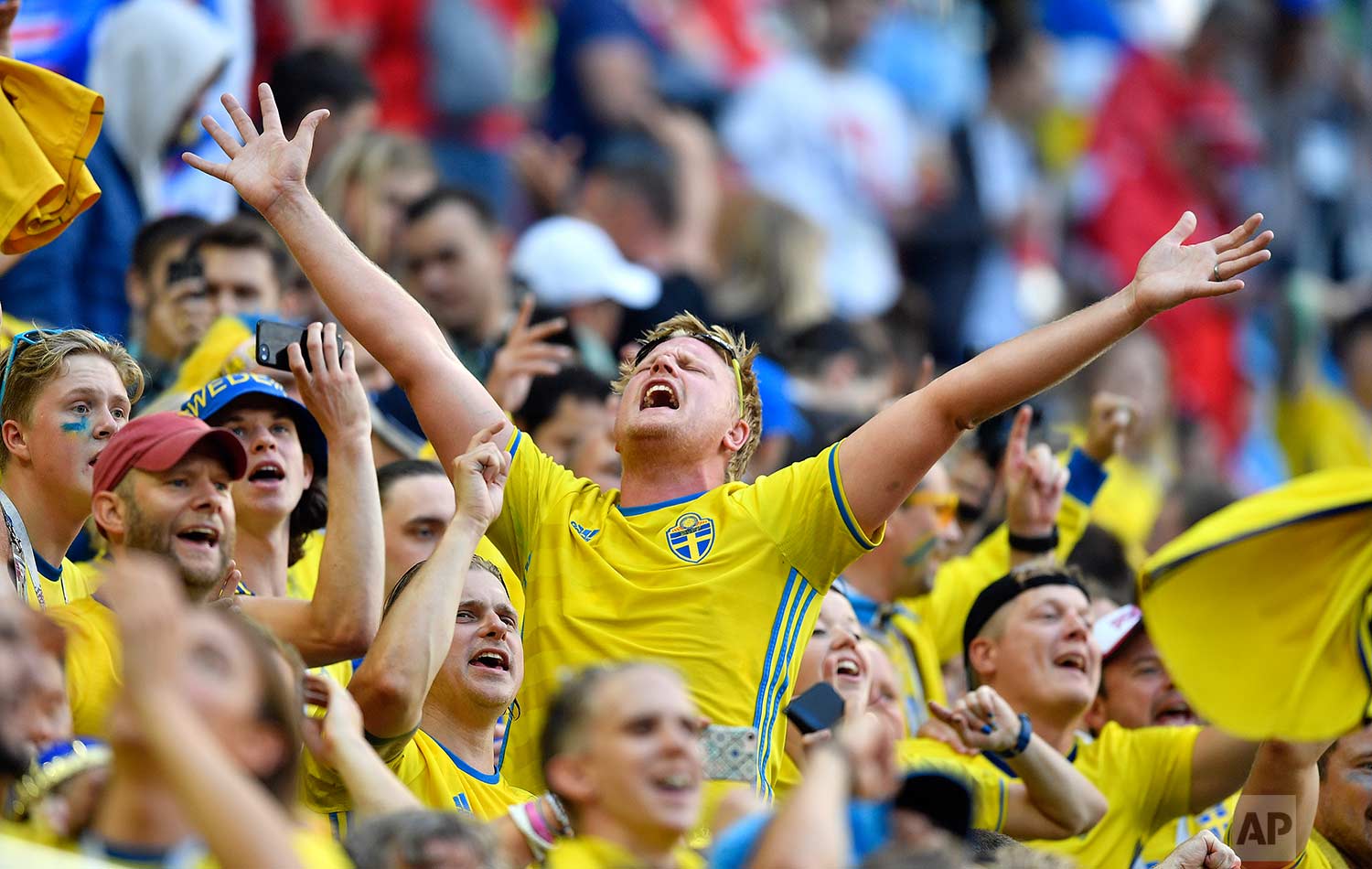 Sweden supporters celebrate after their team won the round of 16 match between Switzerland and Sweden at the 2018 soccer World Cup in the St. Petersburg Stadium, in St. Petersburg, Russia, Tuesday, July 3, 2018. (AP Photo/Martin Meissner)