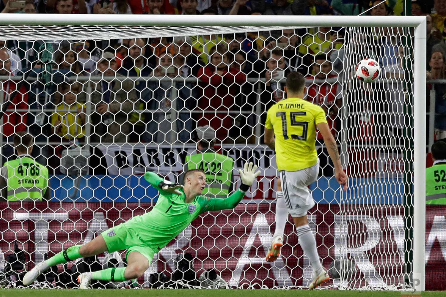 Colombia's Mateus Uribe fails to score on a penalty in the round of 16 match between Colombia and England at the 2018 soccer World Cup in the Spartak Stadium, in Moscow, Russia, Tuesday, July 3, 2018. England eliminates Colombia 4-3 on penalties after the game ends 1-1. (AP Photo/Matthias Schrader)