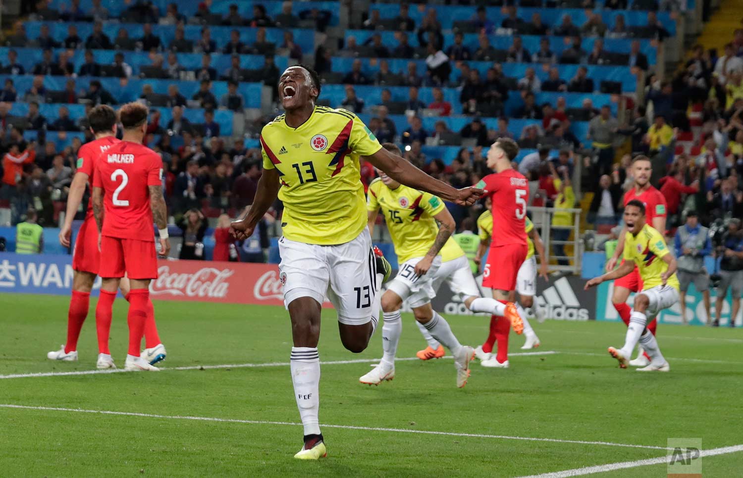 Colombia's Yerry Mina celebrates after scoring his first side's goal during the round of 16 match between Colombia and England at the 2018 soccer World Cup in the Spartak Stadium, in Moscow, Russia, Tuesday, July 3, 2018. (AP Photo/Ricardo Mazalan)