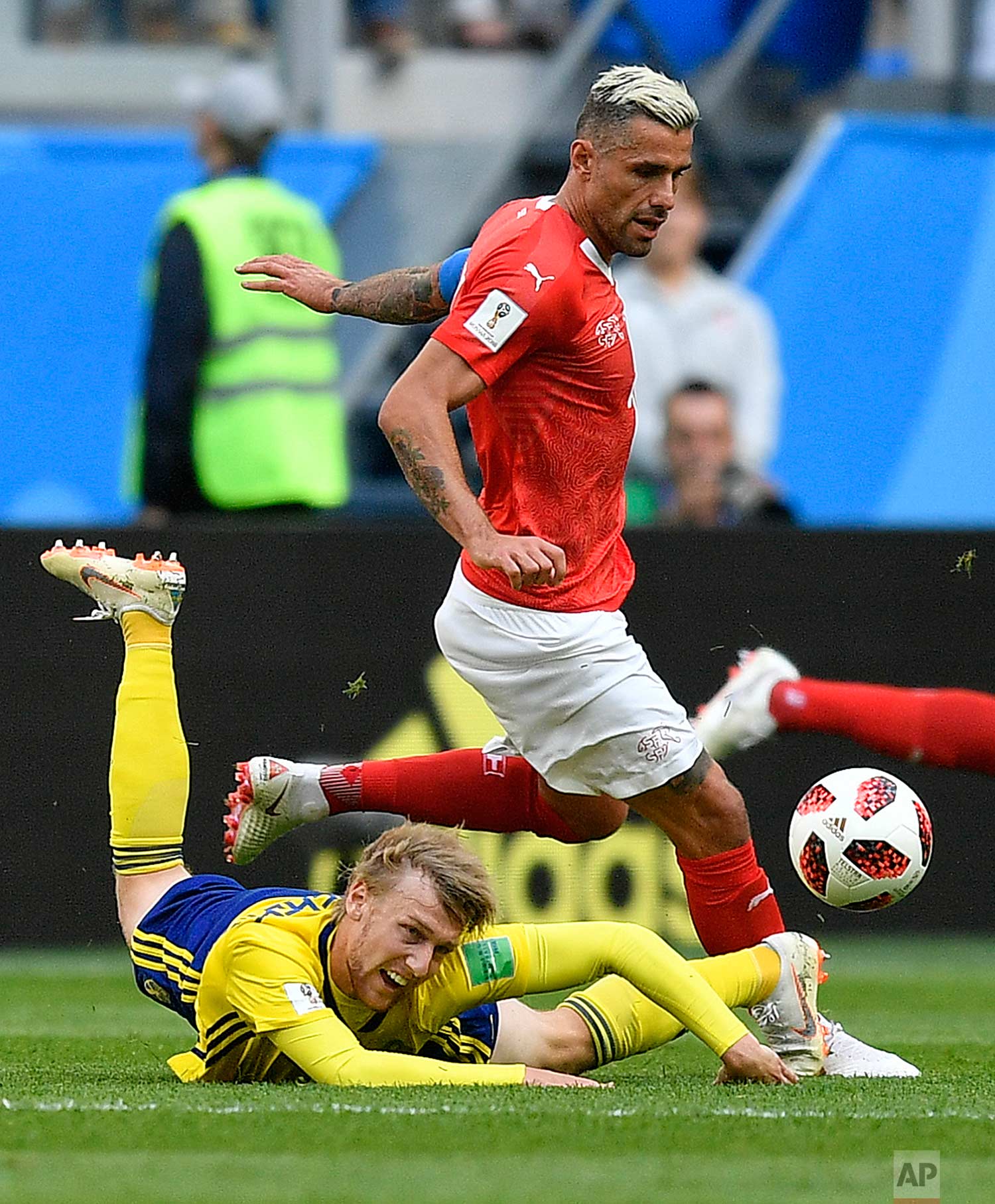  Switzerland's Valon Behrami, rear, and Sweden's Emil Forsberg challenge for the ball during the round of 16 match between Switzerland and Sweden at the 2018 soccer World Cup in the St. Petersburg Stadium, in St. Petersburg, Russia, Tuesday, July 3, 