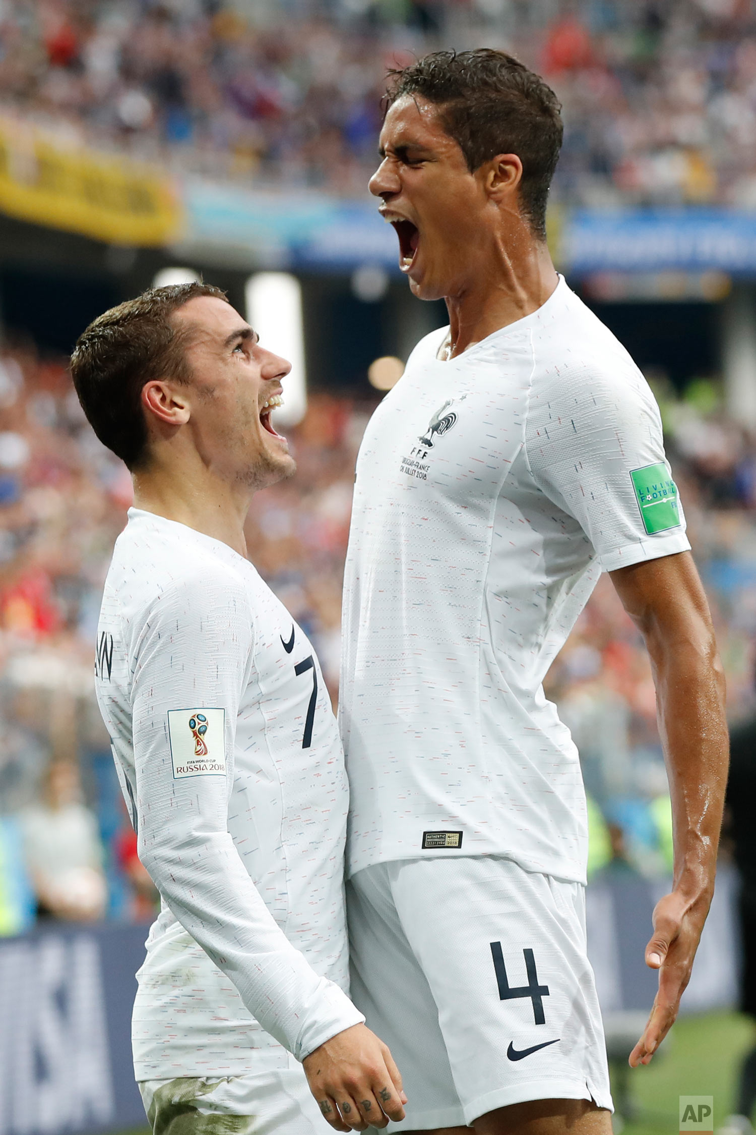  France's Raphael Varane, right, and Antoine Griezmann celebrate after Varane scored his side's first goal during the quarterfinal match between Uruguay and France at the 2018 soccer World Cup in the Nizhny Novgorod Stadium, in Nizhny Novgorod, Russi