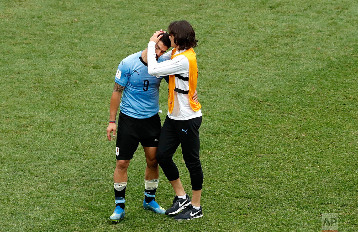  Uruguay's Edinson Cavani embraces teammate Luis Suarez, left, at the end of the quarterfinal match between Uruguay and France at the 2018 soccer World Cup in the Nizhny Novgorod Stadium, in Nizhny Novgorod, Russia, Friday, July 6, 2018. (AP Photo/Ha