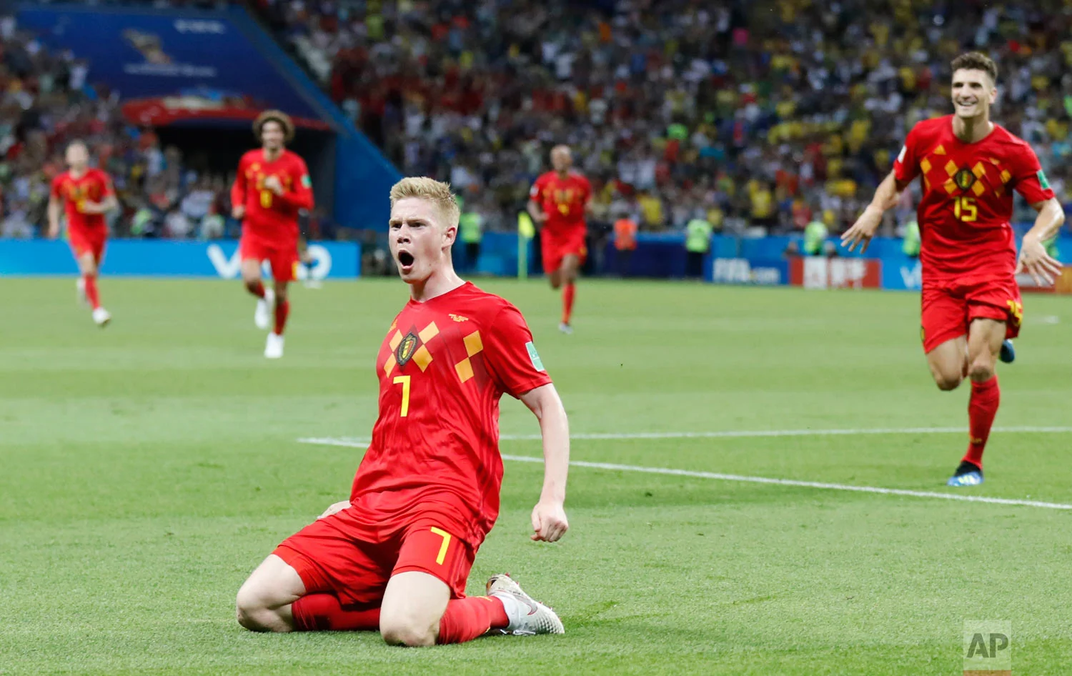 Belgium's Kevin De Bruyne, center, celebrates after scoring his side's second goal during the quarterfinal match between Brazil and Belgium at the 2018 soccer World Cup in the Kazan Arena, in Kazan, Russia, Friday, July 6, 2018. (AP Photo/Frank Augstein)