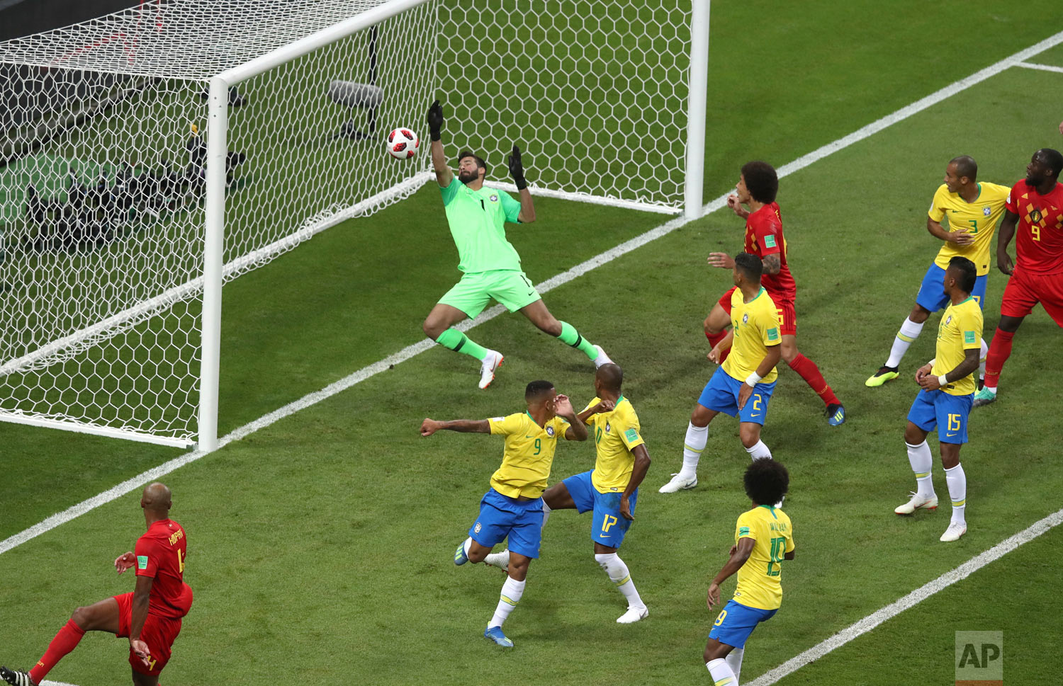  Brazil goalkeeper Alisson, center, fails to stop Belgium's first goal during the quarterfinal match between Brazil and Belgium at the 2018 soccer World Cup in the Kazan Arena, in Kazan, Russia, Friday, July 6, 2018. (AP Photo/Thanassis Stavrakis) 