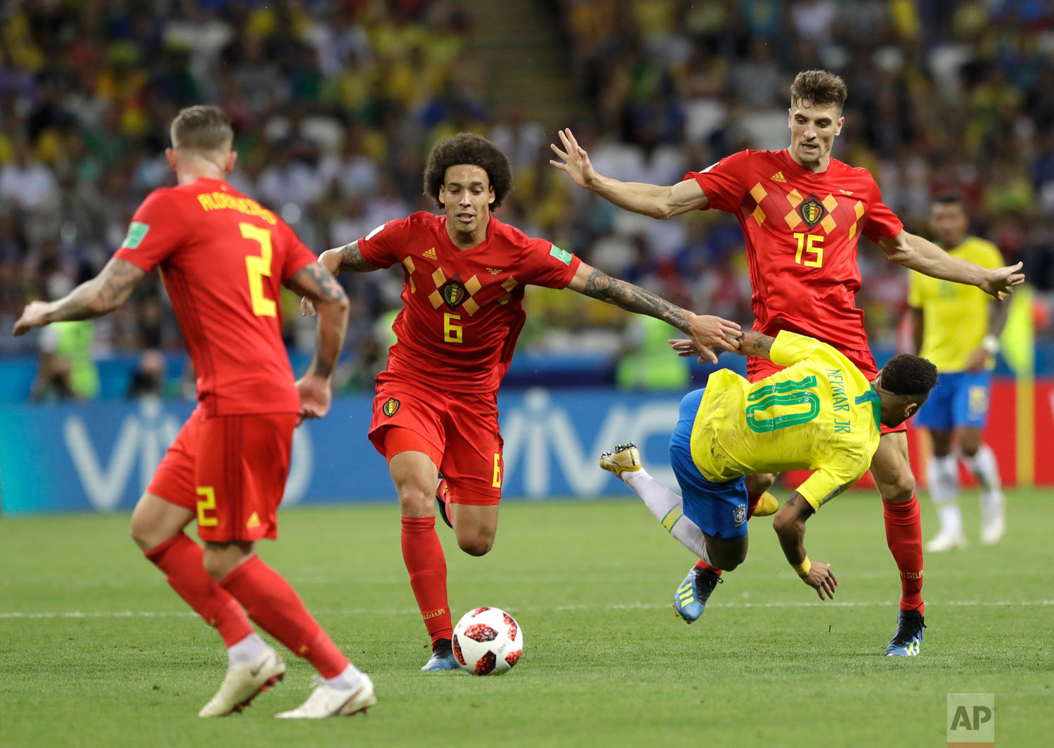  Brazil's Neymar takes a fall while battling Belgium's Axel Witsel, center, and Thomas Meunier, right, during the quarterfinal match between Brazil and Belgium at the 2018 soccer World Cup in the Kazan Arena, in Kazan, Russia, Friday, July 6, 2018. (