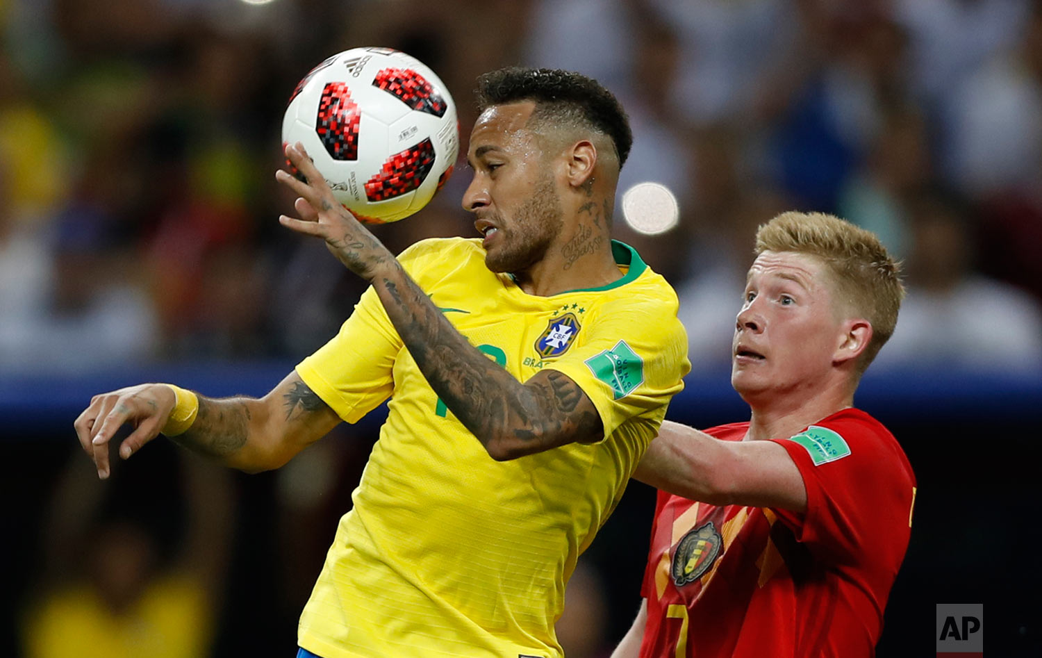  Brazil's Neymar, left, and Belgium's Kevin De Bruyne go for a header during the quarterfinal match between Brazil and Belgium at the 2018 soccer World Cup in the Kazan Arena, in Kazan, Russia, Friday, July 6, 2018. (AP Photo/Francisco Seco) 