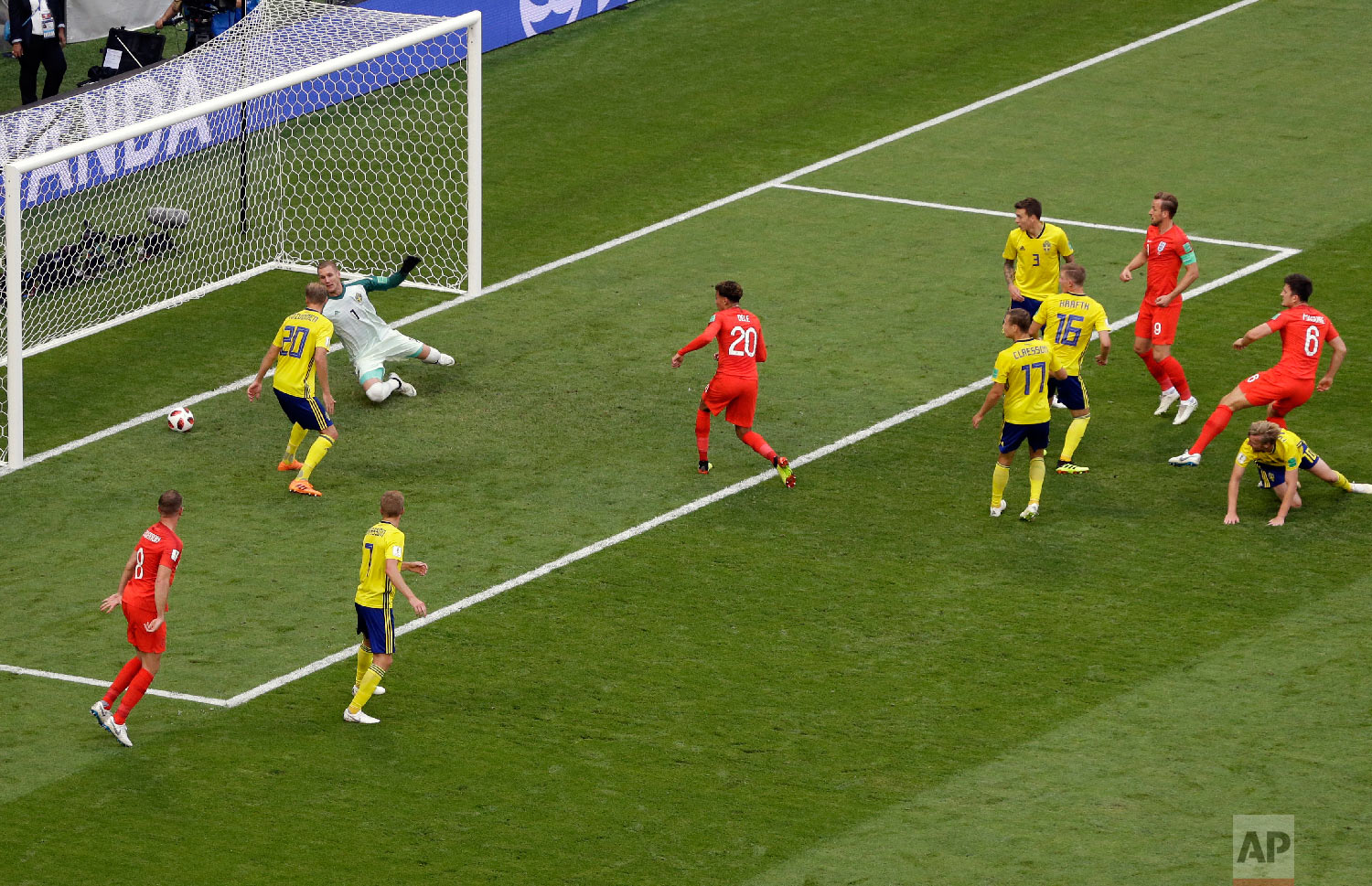  England's Harry Maguire, right, scores the opening goal during the quarterfinal match between Sweden and England at the 2018 soccer World Cup in the Samara Arena, in Samara, Russia, Saturday, July 7, 2018. (AP Photo/Thanassis Stavrakis) 