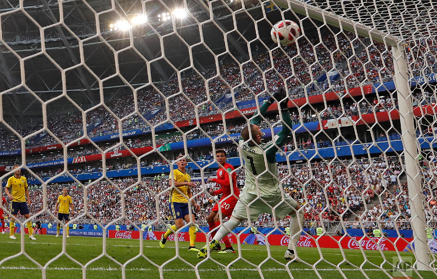  England's Dele Alli, second right, scores his side's second goal during the quarterfinal match between Sweden and England at the 2018 soccer World Cup in the Samara Arena, in Samara, Russia, Saturday, July 7, 2018. (AP Photo/Frank Augstein) 