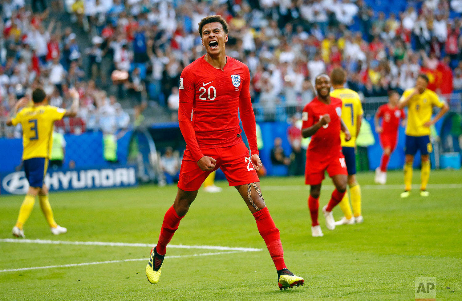  England's Dele Alli celebrates after scoring his side's second goal during the quarterfinal match between Sweden and England at the 2018 soccer World Cup in the Samara Arena, in Samara, Russia, Saturday, July 7, 2018. (AP Photo/Matthias Schrader) 