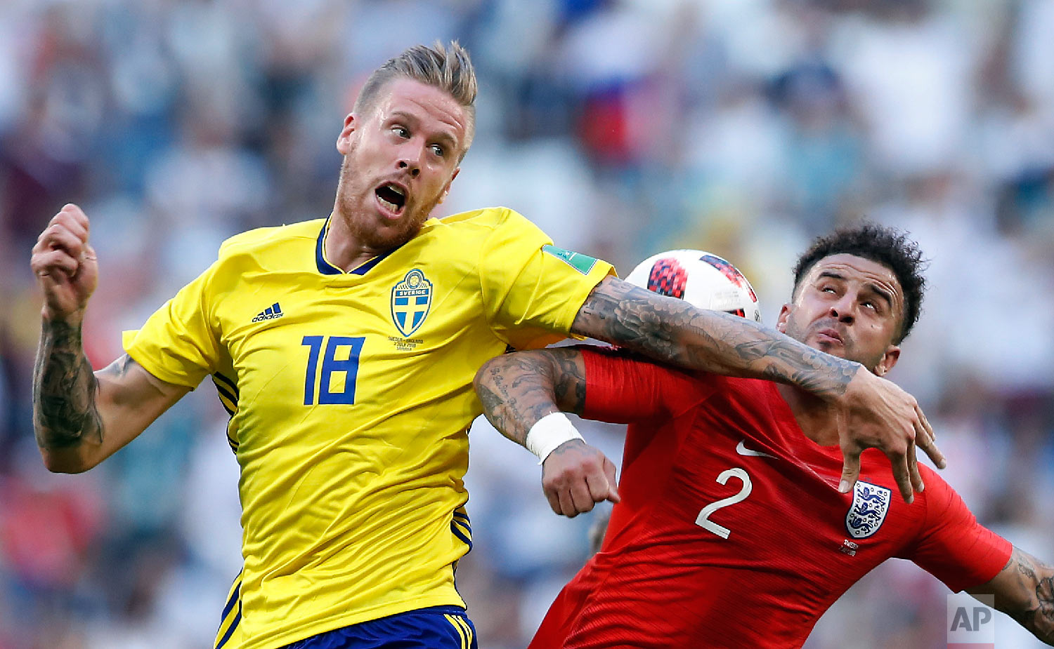  Sweden's Pontus Jansson, left, challenges for the ball with England's Kyle Walker during the quarterfinal match between Sweden and England at the 2018 soccer World Cup in the Samara Arena, in Samara, Russia, Saturday, July 7, 2018. (AP Photo/Alastai