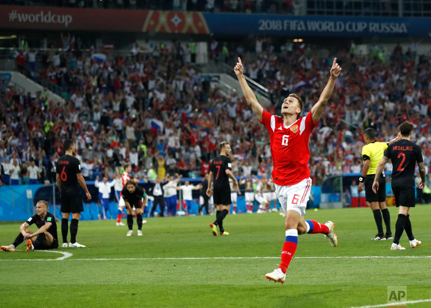  Russia's Denis Cheryshev celebrates after scoring his side's first goal during the quarterfinal match between Russia and Croatia at the 2018 soccer World Cup in the Fisht Stadium, in Sochi, Russia, Saturday, July 7, 2018. (AP Photo/Pavel Golovkin) 
