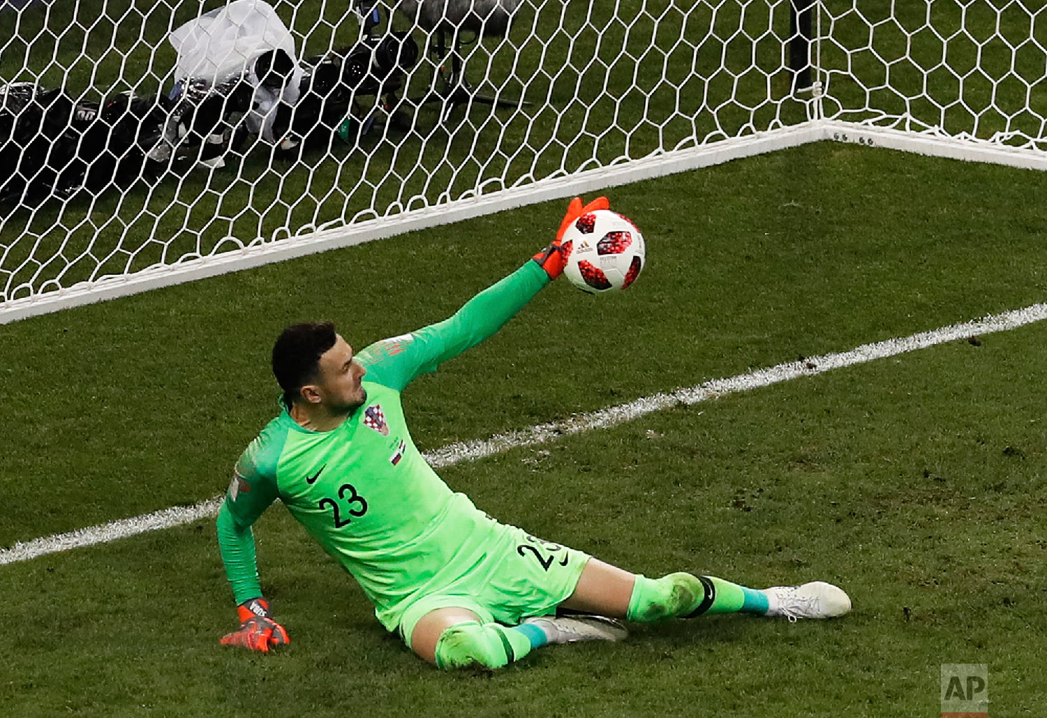  Croatia goalkeeper Danijel Subasic stops a shot from Russia's Fyodor Smolov during a penalty shootout at the end of the quarterfinal match between Russia and Croatia at the 2018 soccer World Cup at the Fisht Stadium in Sochi, Russia, Saturday, July 