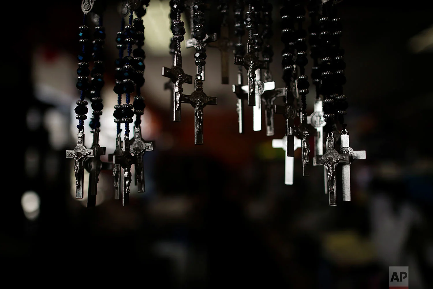 A set of crosses are displayed for sale at La Guadalupana in Florence, Ky.. (AP Photo/Gregory Bull)