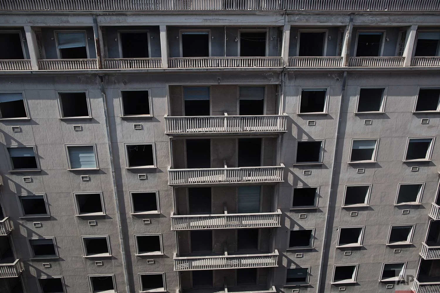 The facade of the former Ambassadeur hotel in Athens is photographed. (AP Photo/Petros Giannakouris)