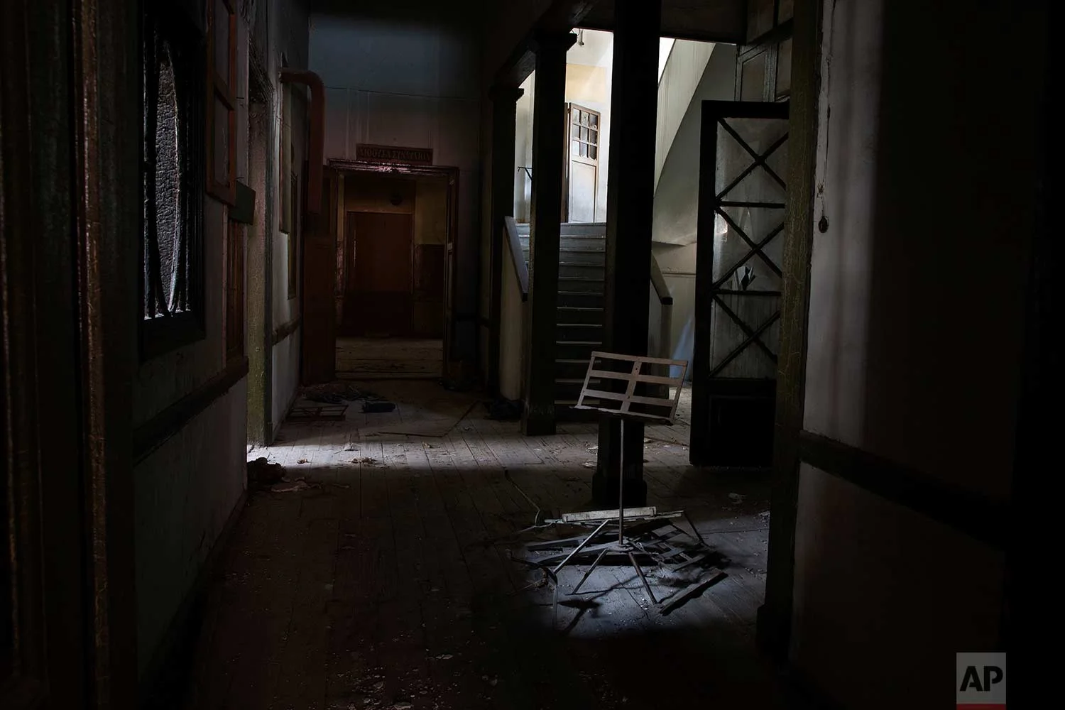 An ancient sheet-music stand is erected, at the entrance to a derelict music school in one of the oldest houses in Athens, dating to 1837. (AP Photo/Petros Giannakouris)