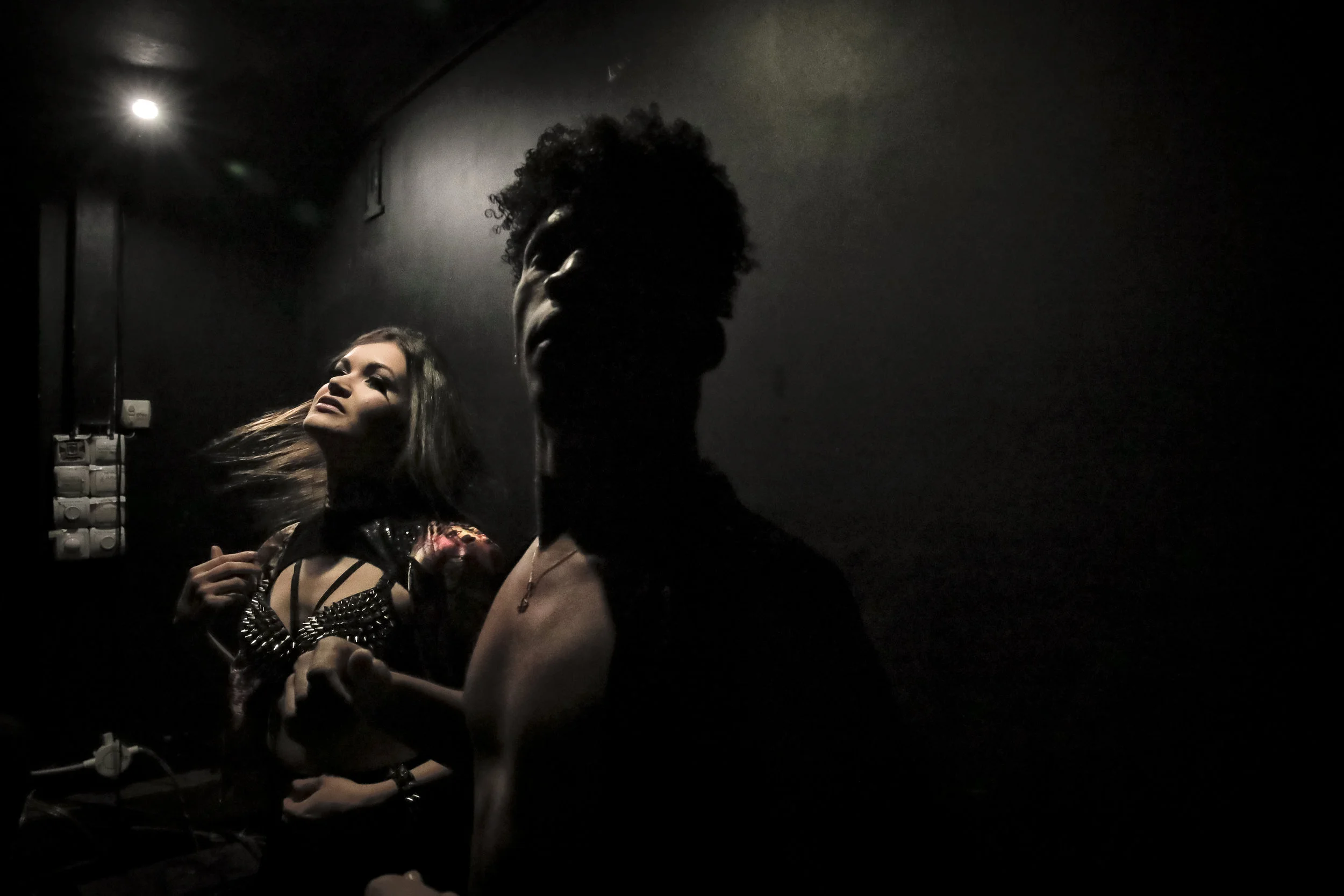 Dancers Dinara, left, and Johan, stretch backstage before performing at the Fame gay club during the 2018 soccer World Cup in Yekaterinburg, Russia. (AP Photo/Vadim Ghirda)