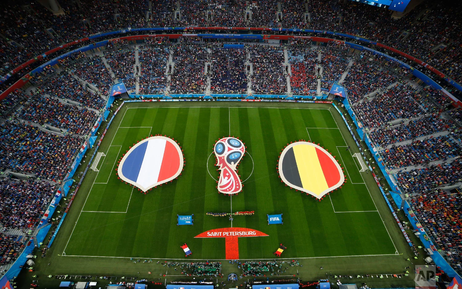 Belgium's and french flags are displayed prior to the semifinal match between France and Belgium at the 2018 soccer World Cup in the St. Petersburg Stadium in St. Petersburg, Russia, Tuesday, July 10, 2018. (AP Photo/Dmitri Lovetsky)