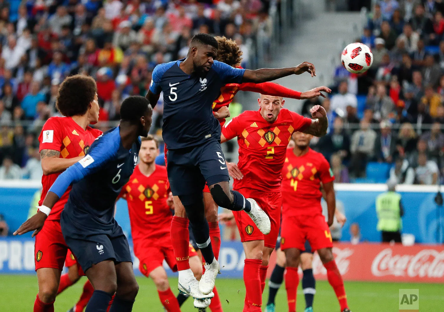 France's Samuel Umtiti, (5) heads the ball to score the opening goal of the game during the semifinal match between France and Belgium at the 2018 soccer World Cup in the St. Petersburg Stadium in, St. Petersburg, Russia, Tuesday, July 10, 2018. (AP Photo/Natacha Pisarenko)