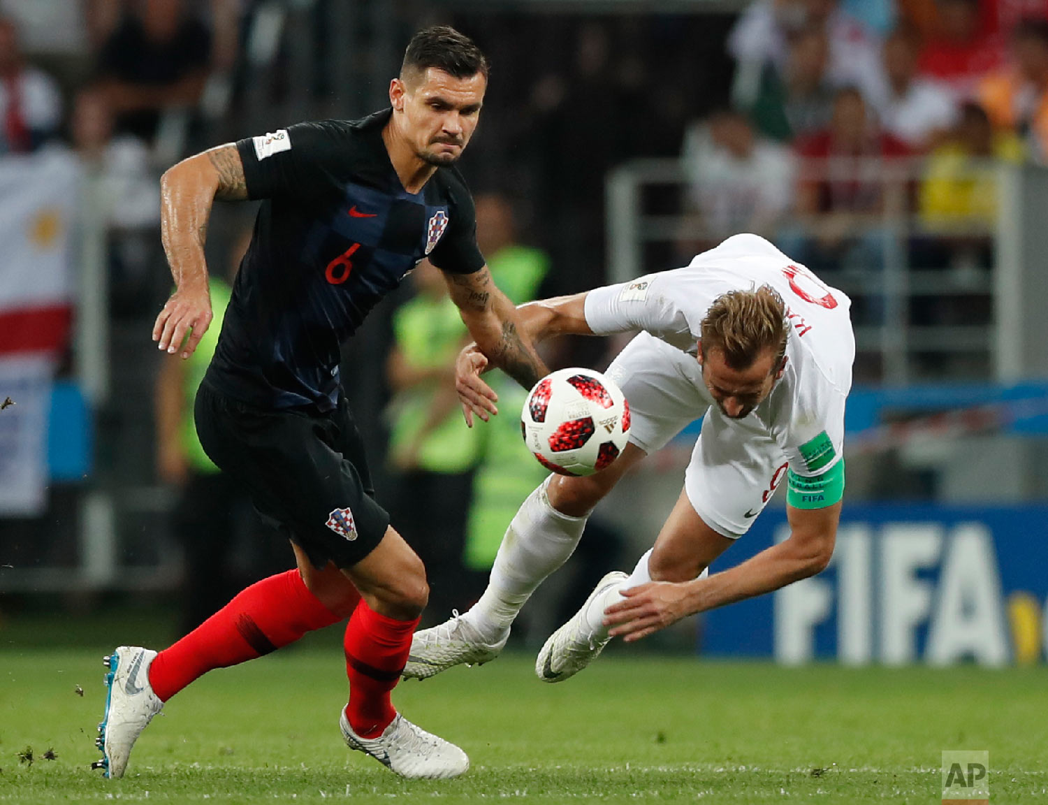  Croatia's Dejan Lovren, left, and England's Harry Kane challenge for the ball during the semifinal match between Croatia and England at the 2018 soccer World Cup in the Luzhniki Stadium in, Moscow, Russia, Wednesday, July 11, 2018. (AP Photo/Alastai