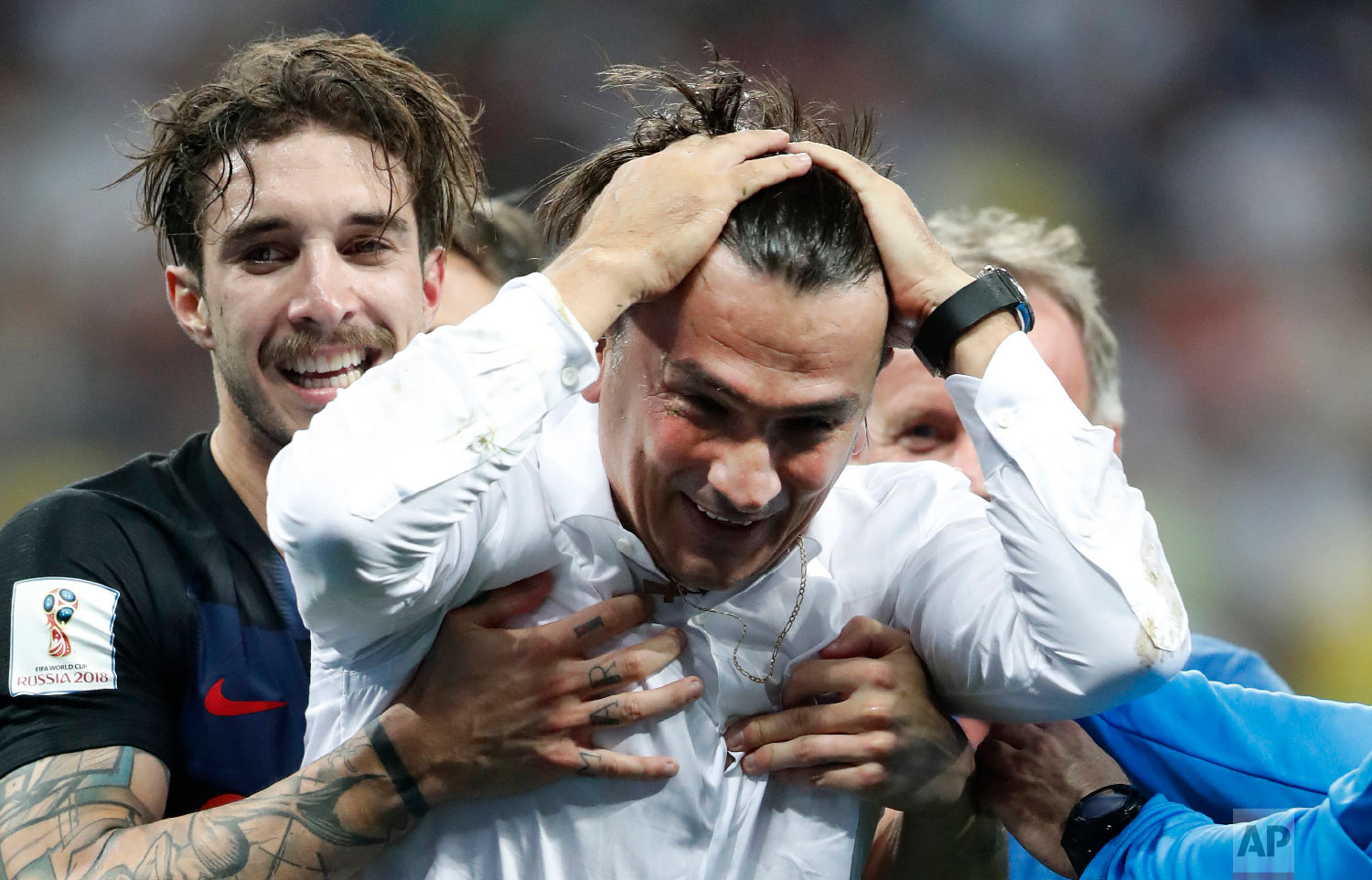  Croatia head coach Zlatko Dalic celebrates with Sime Vrsaljko, left, after his team advanced to the final during the semifinal match between Croatia and England at the 2018 soccer World Cup in the Luzhniki Stadium in Moscow, Russia, Wednesday, July 