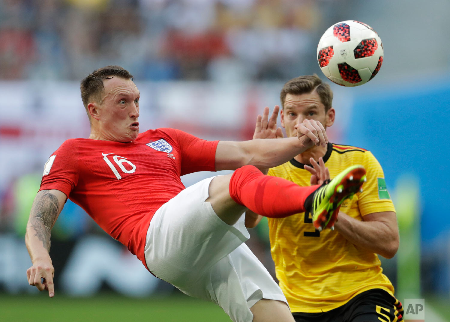  England's Phil Jones left controls a ball in front of Belgium's Jan Vertonghen during the third place match between England and Belgium at the 2018 soccer World Cup in the St. Petersburg Stadium in St. Petersburg, Russia, Saturday, July 14, 2018. (A
