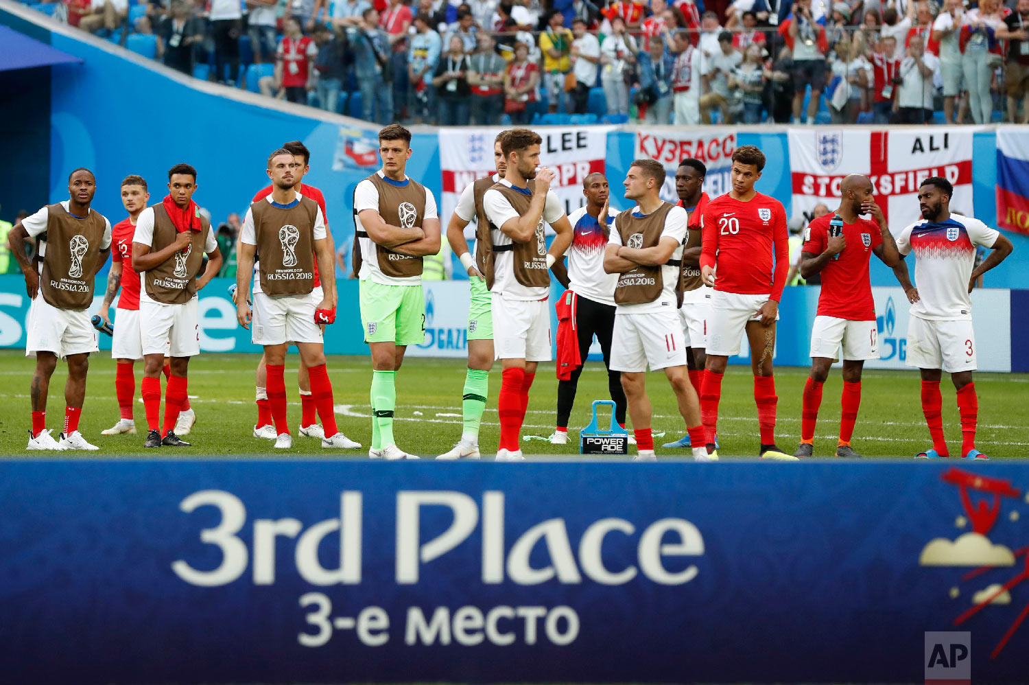  England players look on as Belgium is recognized as the third place winner after defeating England in the third place match at the 2018 soccer World Cup in the St. Petersburg Stadium in St. Petersburg, Russia, Saturday, July 14, 2018. (AP Photo/Petr