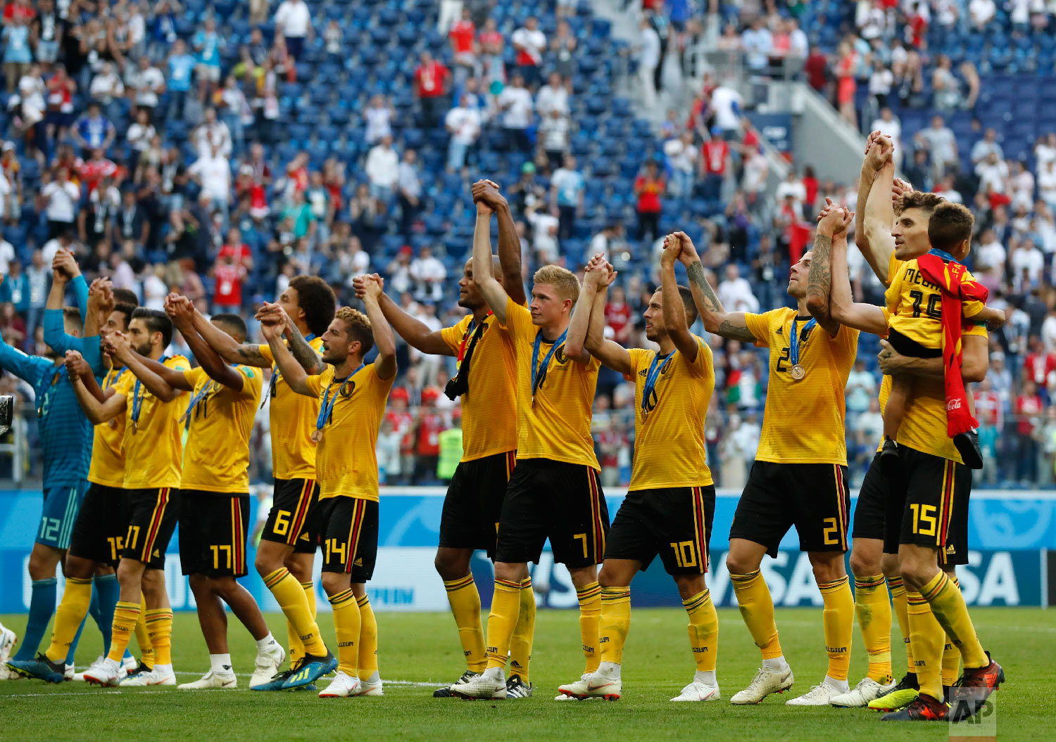 Belgium players salute the fans after defeating England in the third place match at the 2018 soccer World Cup in the St. Petersburg Stadium in St. Petersburg, Russia, Saturday, July 14, 2018. (AP Photo/Petr David Josek)