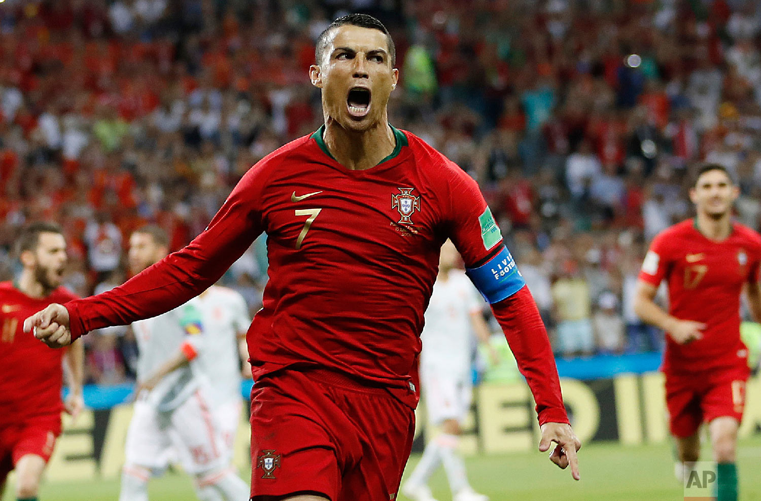 Portugal's Cristiano Ronaldo celebrates his side's opening goal during the group B match between Portugal and Spain at the 2018 soccer World Cup in the Fisht Stadium in Sochi, Russia on June 15, 2018. (AP Photo/Francisco Seco)
