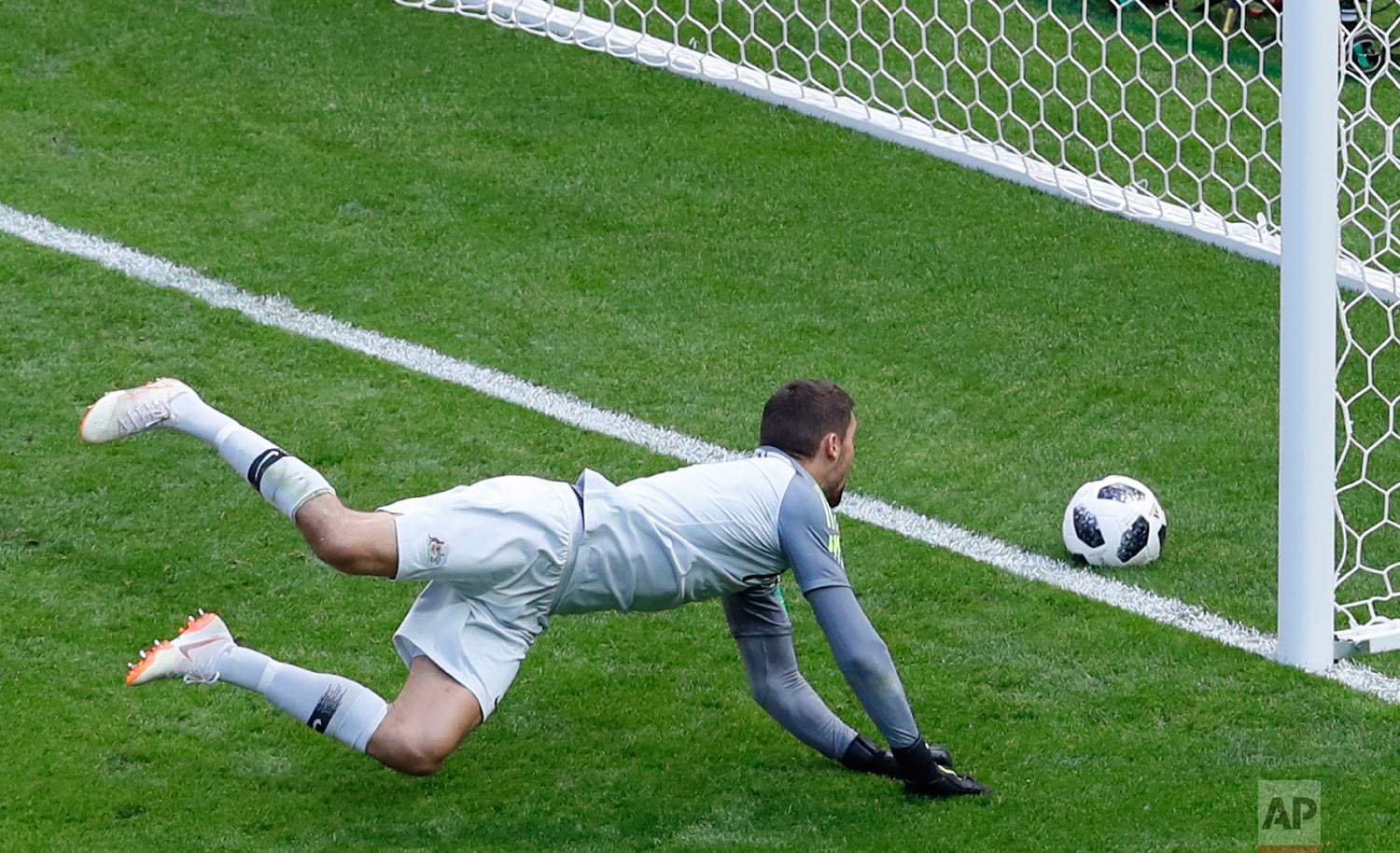 Australia goalkeeper Mathew Ryan fails to save the ball as France's Paul Pogba his side's second goal during the group C match between France and Australia at the 2018 soccer World Cup in the Kazan Arena in Kazan, Russia on June 16, 2018. (AP Photo/Hassan Ammar)