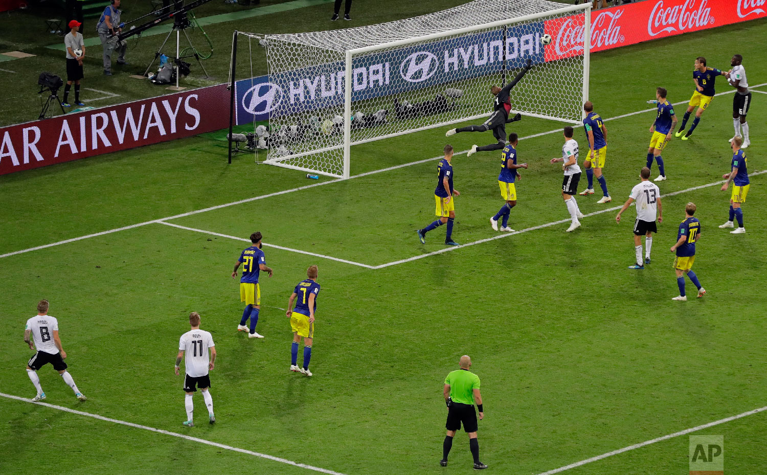 Germany's Toni Kroos, far left, scores his side's second goal during the group F match between Germany and Sweden at the 2018 soccer World Cup in the Fisht Stadium in Sochi, Russia on June 23, 2018. (AP Photo/Sergei Grits)