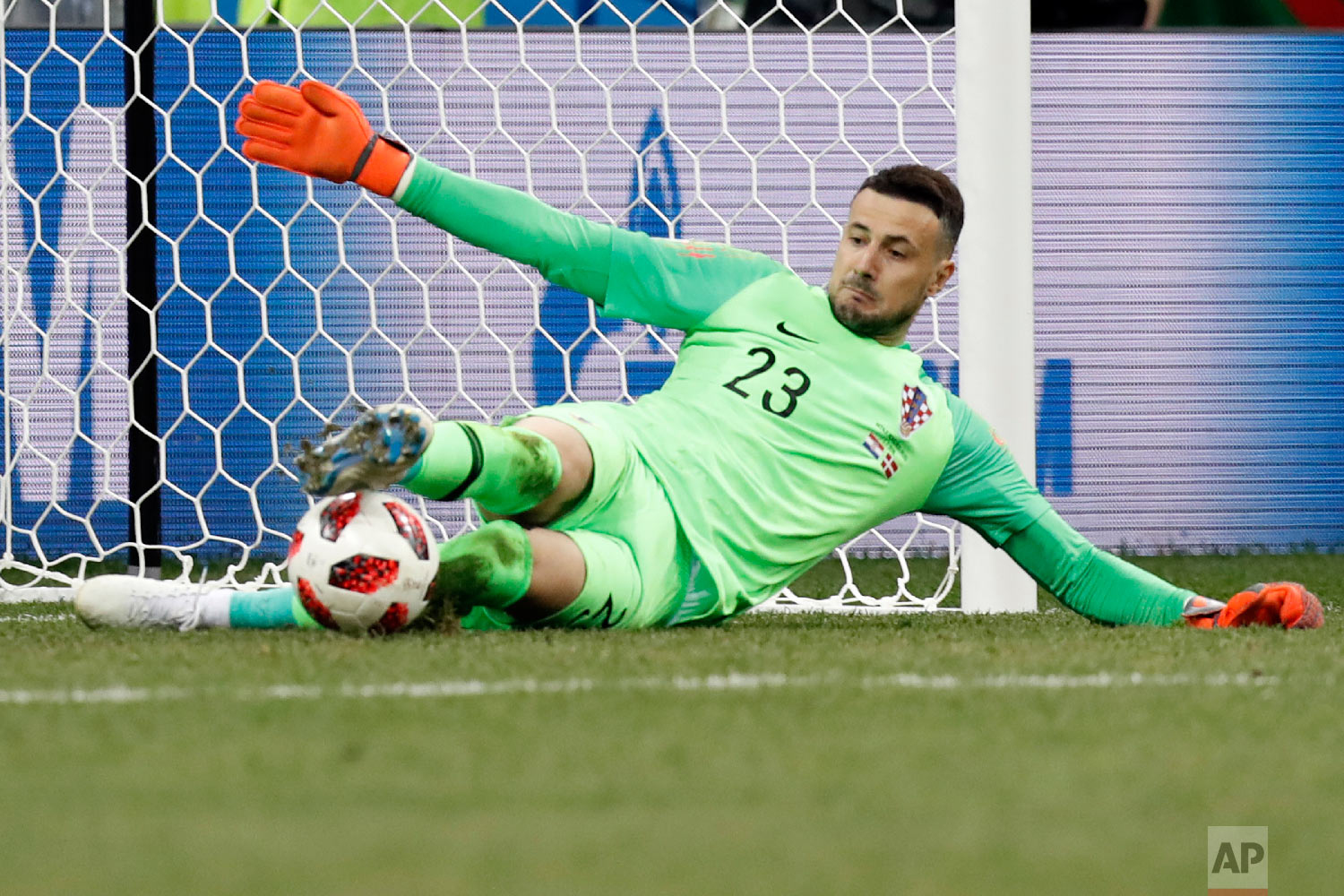 Croatia goalkeeper Danijel Subasic saves the decisive penalty during a penalty shoot out after extra time during the round of 16 match between Croatia and Denmark at the 2018 soccer World Cup in the Nizhny Novgorod Stadium, in Nizhny Novgorod , Russia on July 1, 2018. (AP Photo/Efrem Lukatsky)