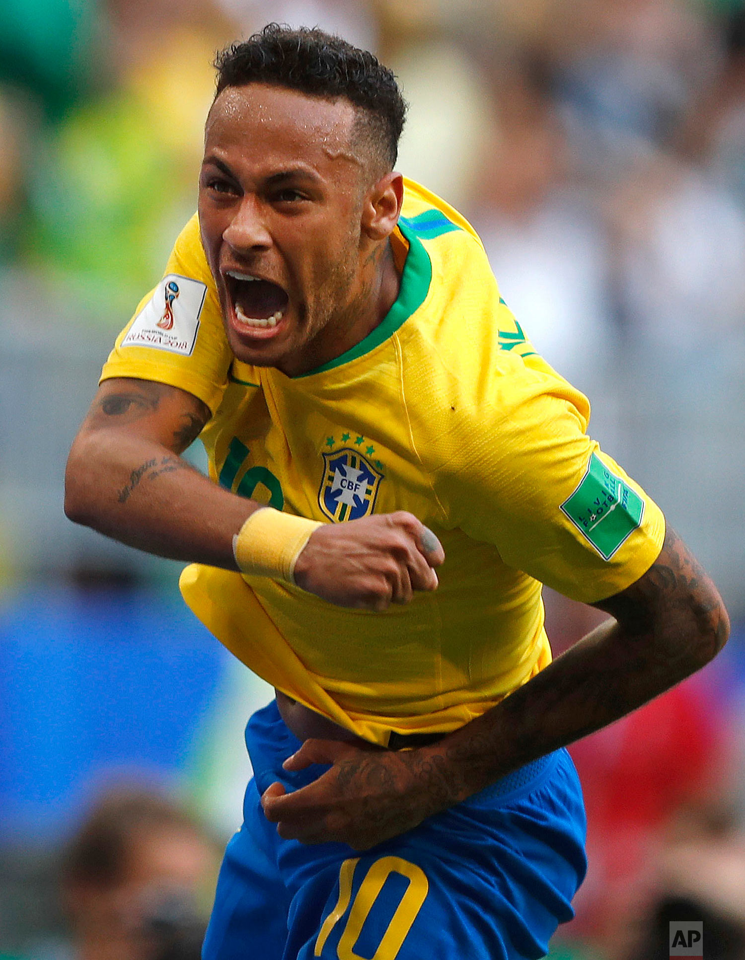 Brazil's Neymar celebrates after scoring his side's opening goal during the round of 16 match between Brazil and Mexico at the 2018 soccer World Cup in the Samara Arena, in Samara, Russia on July 2, 2018. (AP Photo/Frank Augstein)