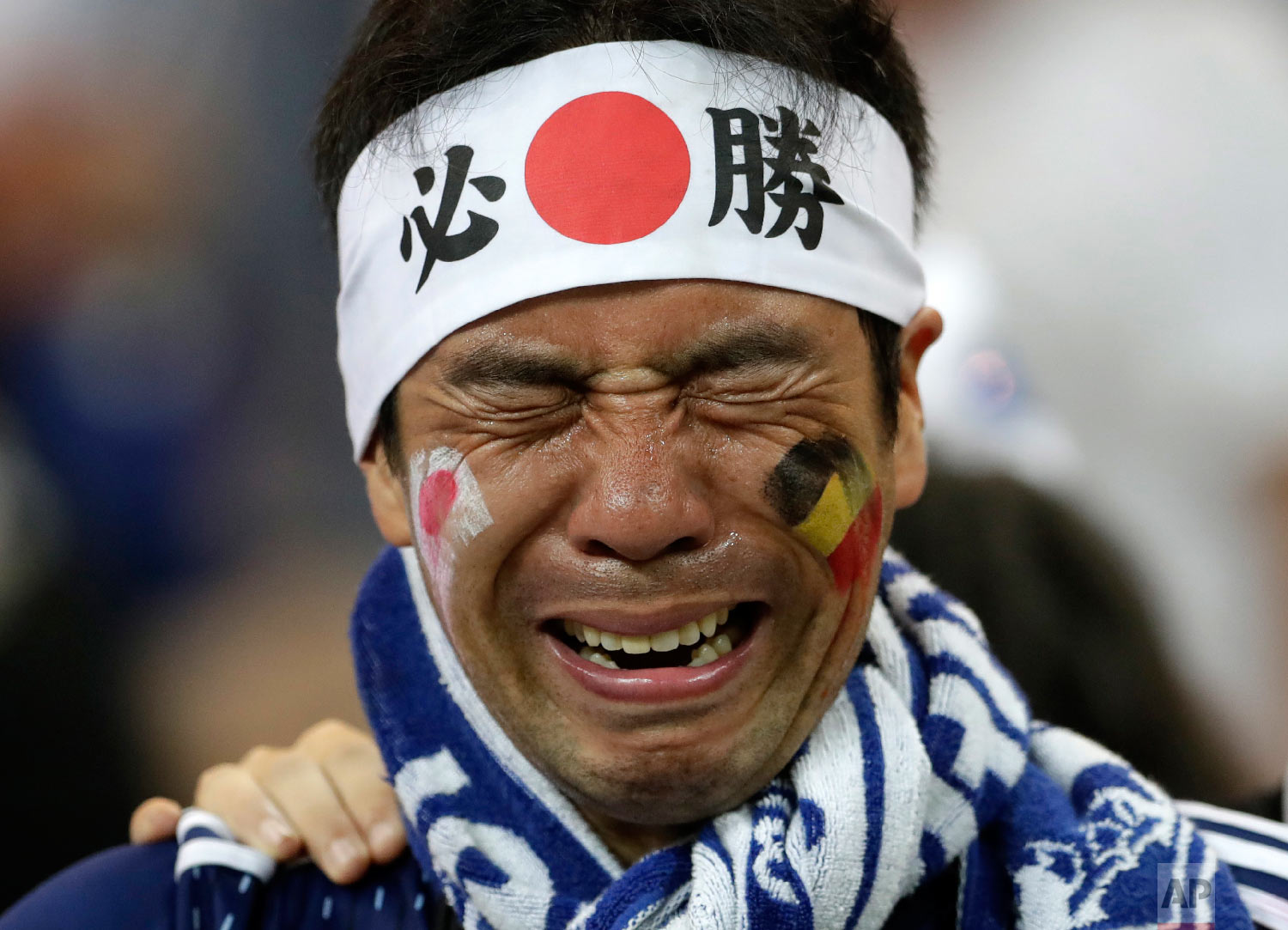  A Japan supporter cries after losing the round of 16 match between Belgium and Japan at the 2018 soccer World Cup in the Rostov Arena, in Rostov-on-Don, Russia, Monday, July 2, 2018. (AP Photo/Petr David Josek) 