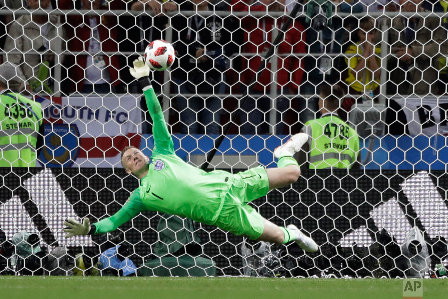  England goalkeeper Jordan Pickford saves a penalty during the round of 16 match between Colombia and England at the 2018 soccer World Cup in the Spartak Stadium, in Moscow, Russia on July 3, 2018. (AP Photo/Matthias Schrader) 
