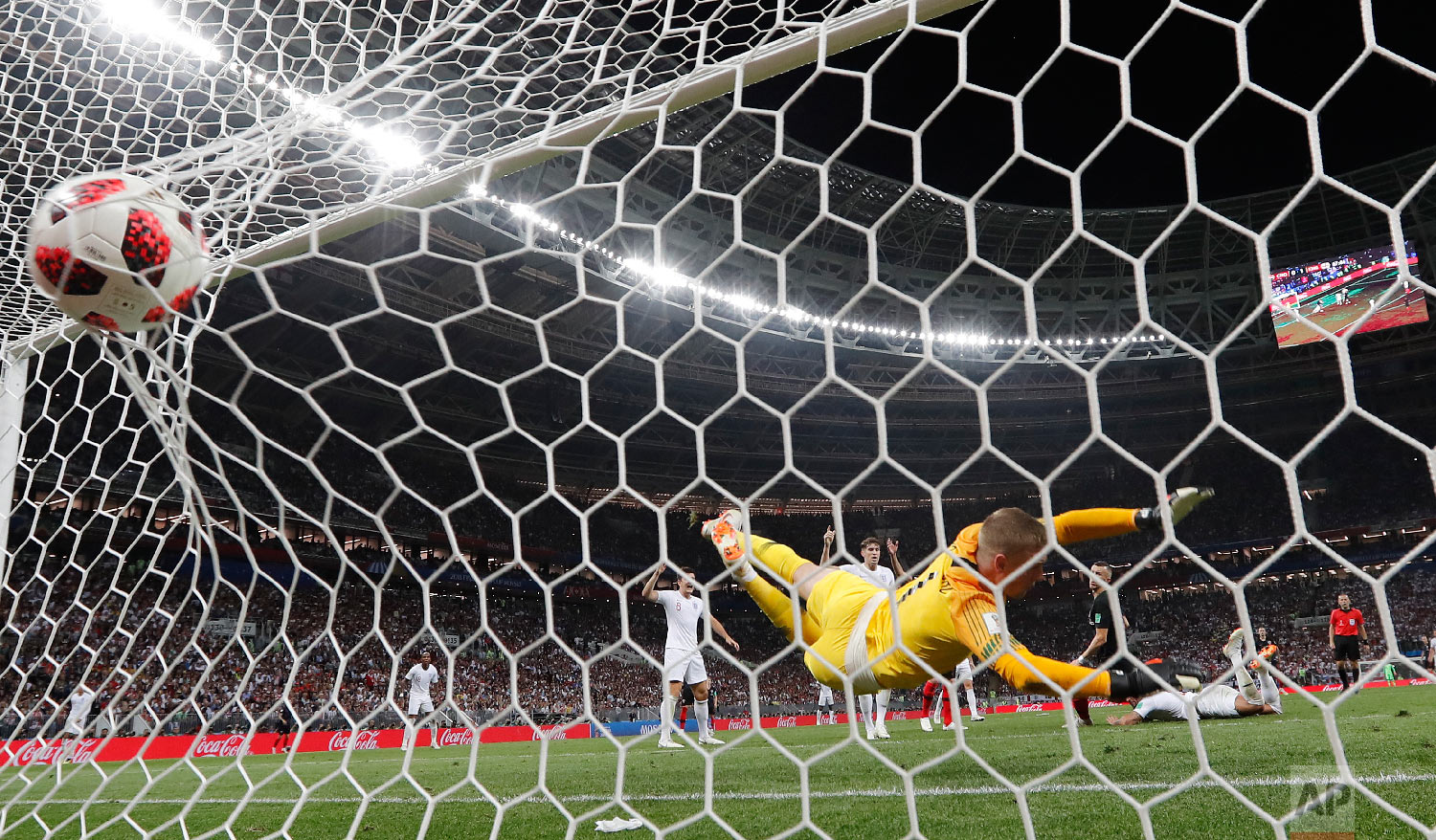 Croatia's Ivan Perisic scores his side's first goal past England goalkeeper Jordan Pickford during the semifinal match between Croatia and England at the 2018 soccer World Cup in the Luzhniki Stadium in Moscow, Russia on July 11, 2018. (AP Photo/Frank Augstein)