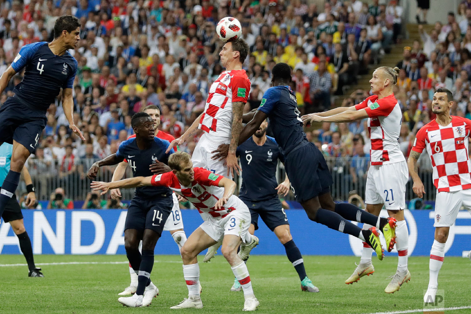  Croatia's Mario Mandzukic, center, scores an own goal during the final match between France and Croatia at the 2018 soccer World Cup in the Luzhniki Stadium in Moscow, Russia, Sunday, July 15, 2018. (AP Photo/Matthias Schrader) 